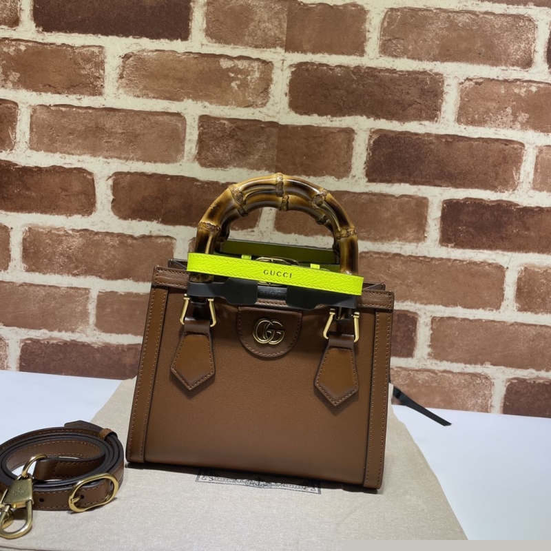 G*u*i top handle bags
